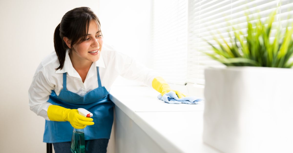 Woman cleaning the countertop