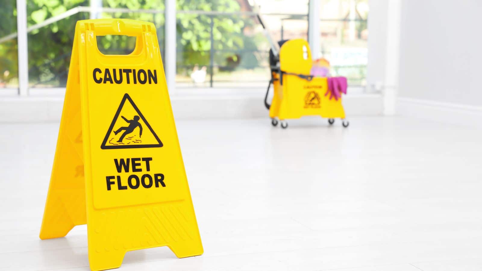 Cleaning pail and wet floor sign