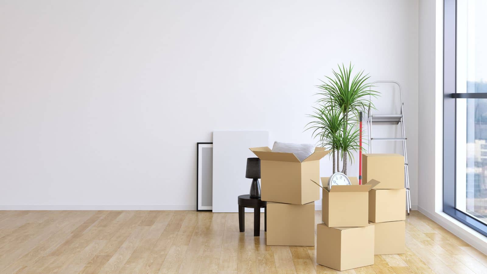 Moving boxes stacked in an empty room