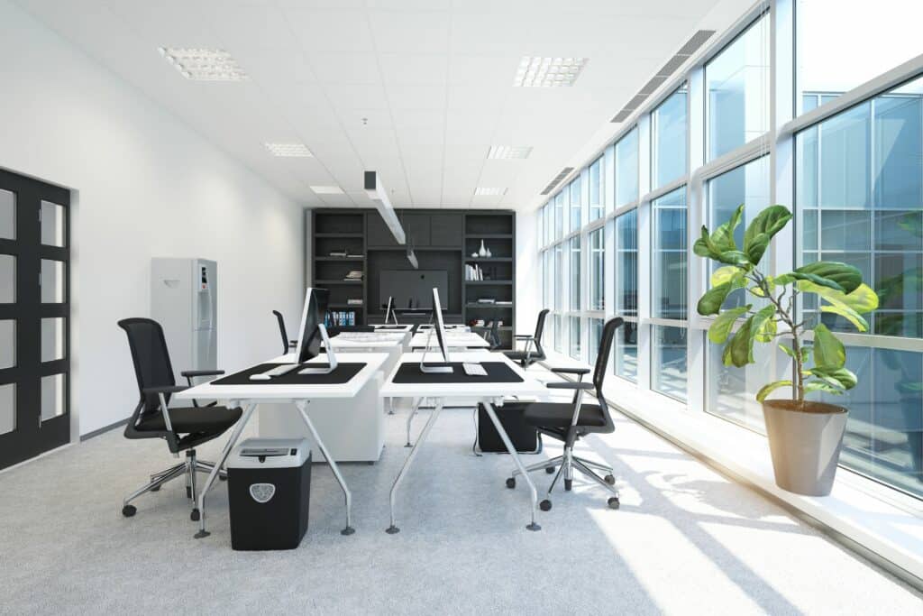 white commercial space with desks and chairs that has been cleaned with a commercial cleaning service